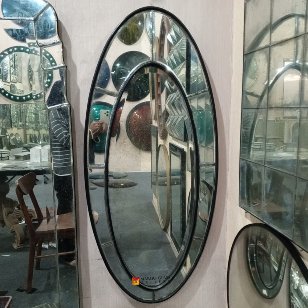Using an Oval Antique Mirror to Soften a Feminine Chic Interior